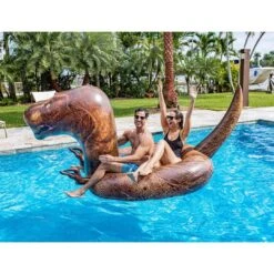 Pool Candy - Gigantic T-Rex Inflatable Pool Float -Swimline Store Gigantic T Rex Inflatable Pool Float 1